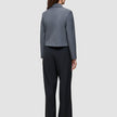 A person seen from behind wearing a grey blazer and black high-waist, wide-leg Serene Pants Wide Black.