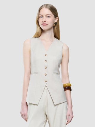 A model wears a Women’s Skye Long Vest Sandy Beige Melange over matching tailored trousers.