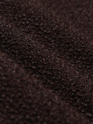 Close-up of the textured, fuzzy dark brown fabric of a Women Sorae Short Jacket Espresso with visible folds.