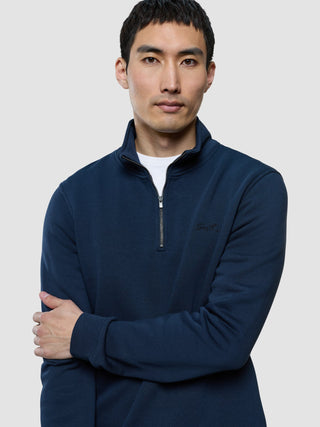 A man wearing a Sweat Half Zip Dark Navy.