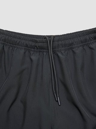 Close-up of the 360° stretch elasticized waistband and drawstring of Swim Shorts Black.