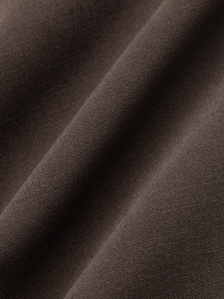 Close-up of Tech Wool Suit Pants Regular Cocoa Brown with a diagonal fold.