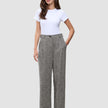 A woman wearing a white t-shirt and grey herringbone bouclé wide-leg Women Ashryn Pants Wide Domino Herringbone.