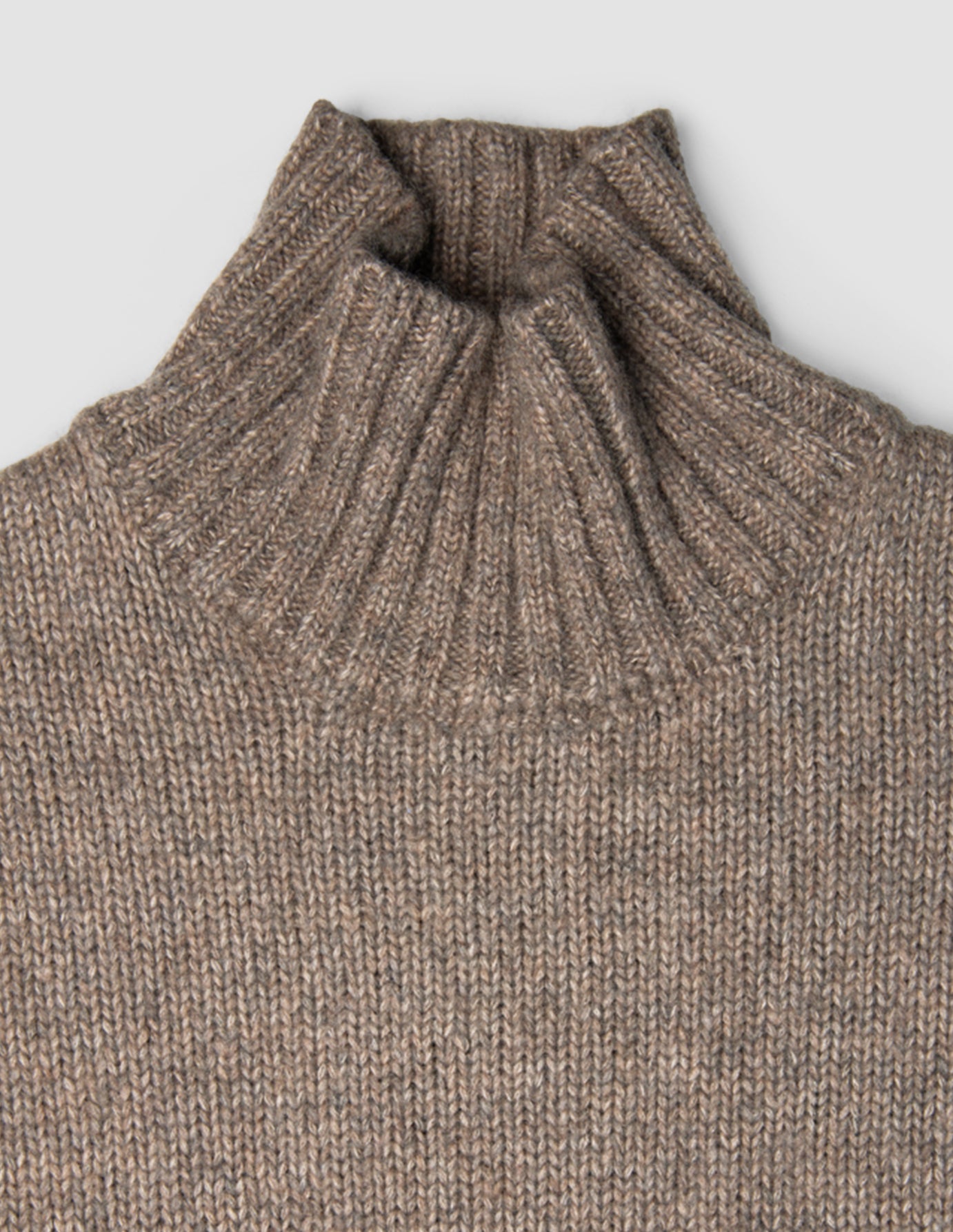 Women Chunky Soft Wool Knit Turtleneck Taupe Melange sweater featuring a chunky knit and a ribbed turtleneck.