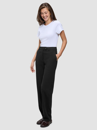A woman wearing a white t-shirt and Women GO2 Pants Straight Black with her hand in her pocket.