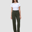 A woman wearing a white t-shirt and Women GO2 Pants Straight Dusty Olive, featuring a high-waisted, straight-leg fit.