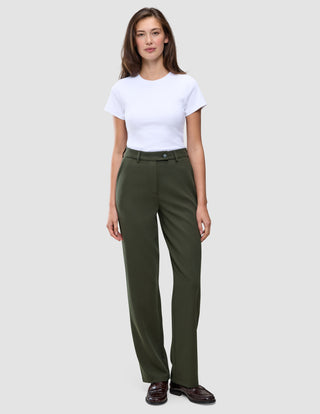 A woman wearing a white t-shirt and Women GO2 Pants Straight Dusty Olive, featuring a high-waisted, straight-leg fit.
