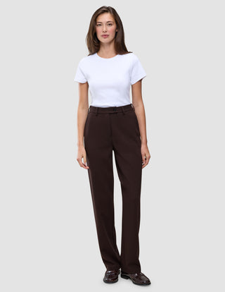A woman wearing a white t-shirt and Women GO2 Pants Straight Mocha, featuring a high-waisted, straight-leg dark brown design.