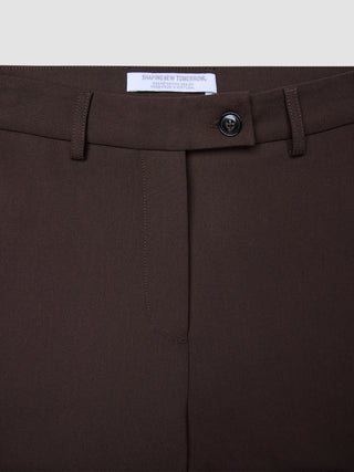 Close-up of the waistband and fly of Women GO2 Pants Straight Mocha, featuring a single button closure and belt loops in a dark brown, Scandinavian-inspired design.