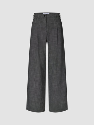 Women Nara Pants Wide Black Check high-waisted wide pants in a black and white micro-check pattern, featuring 360° stretch with a button and zip closure.