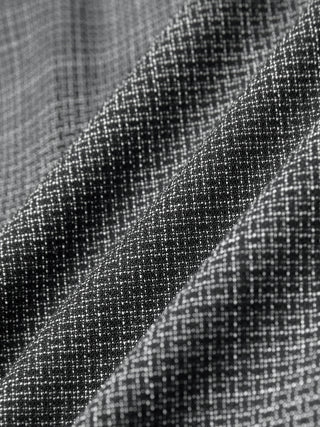 Black and white checkered fabric of Women Nara Pants Wide Black Check with visible folds.