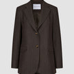 Women Serene Blazer Regular Walnut Herringbone in brown wool with a herringbone texture, two front buttons, and flap pockets in a classic Scandinavian design.