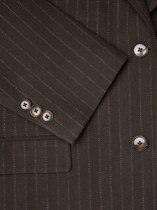 Close-up of a Women Serene Blazer Regular Walnut Herringbone featuring a brown herringbone wool pattern with vertical pinstripes and tortoiseshell buttons on the cuff and front.