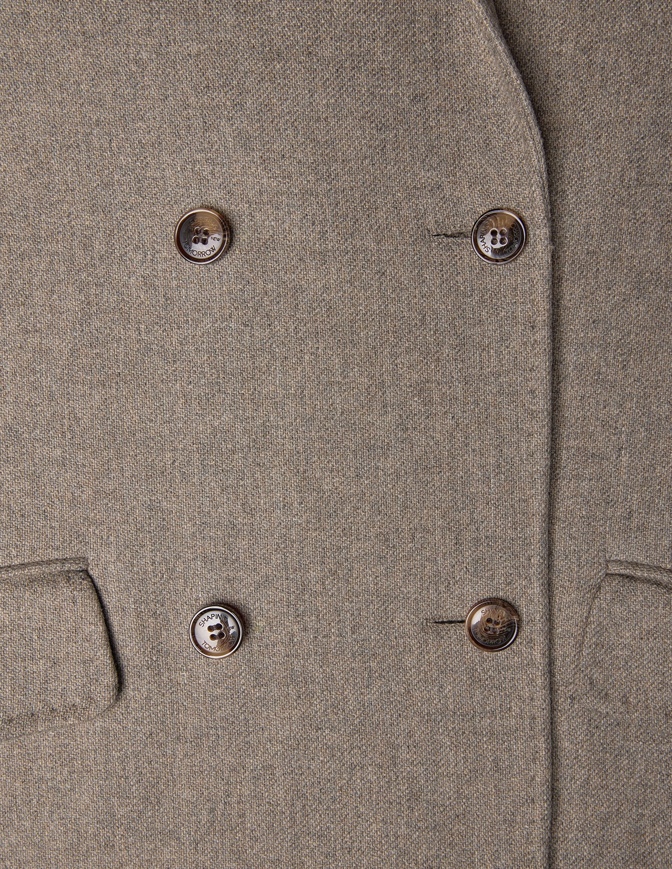 Close-up of a Women Wool Coat Greige, featuring a double-breasted design with four brown buttons in a minimalist Scandinavian style.