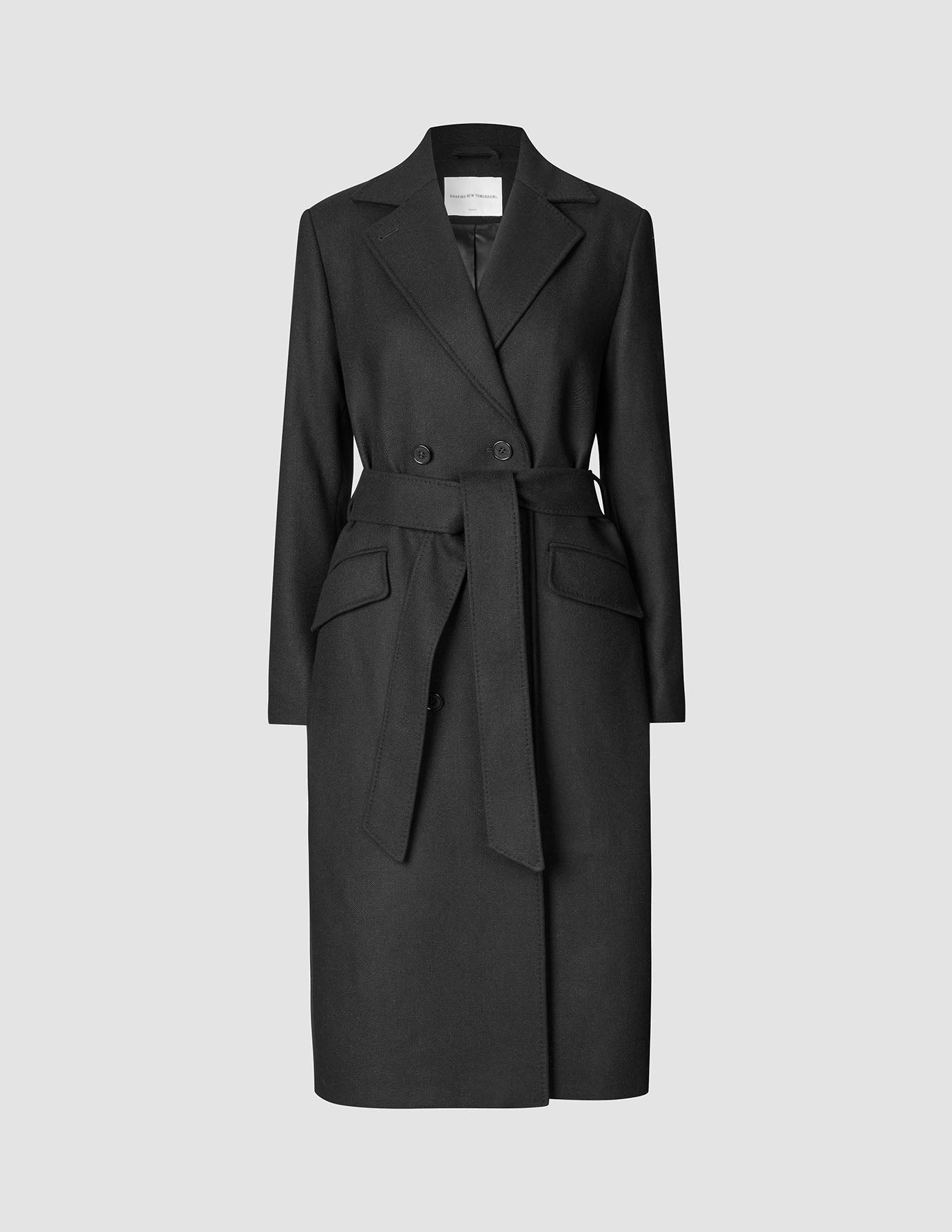 Women’s Wool Coat Black in a double-breasted Scandinavian design featuring a notched lapel and a matching tie belt.