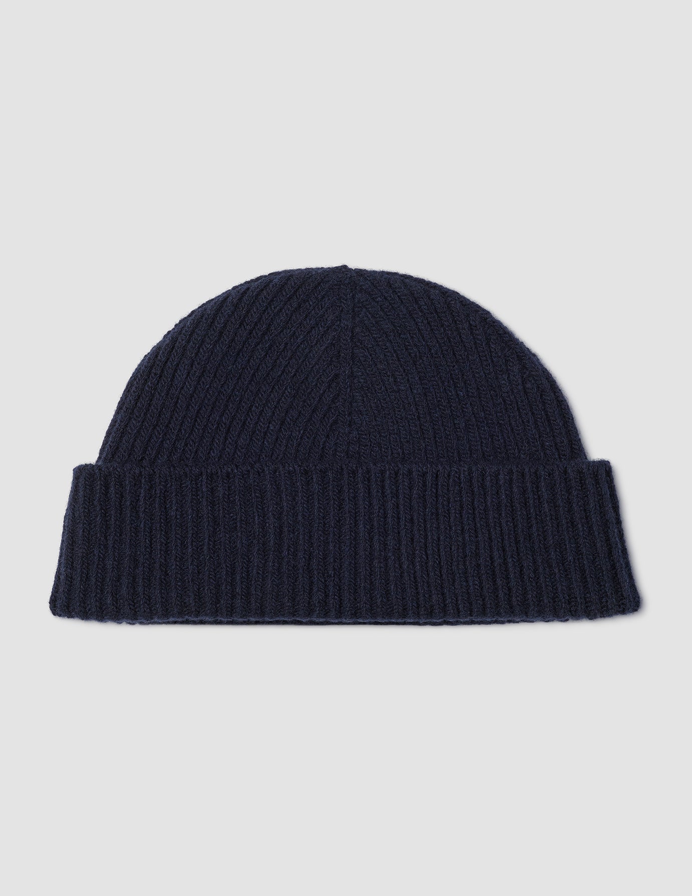 Wool Beanie Navy in navy blue merino wool with a ribbed knit, cuffed brim, and Scandinavian design.