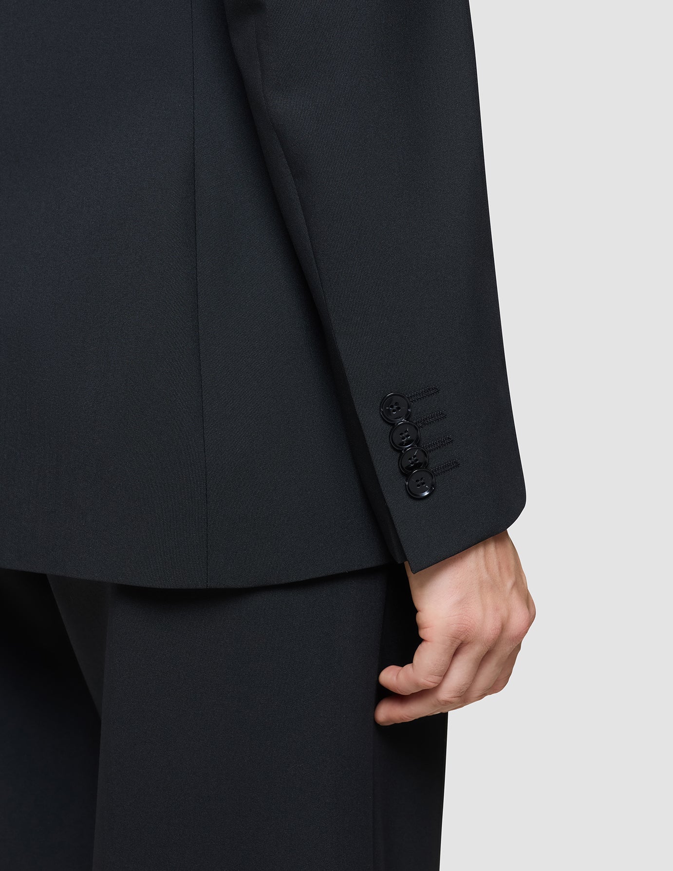 A close-up of the Women’s Avira Blazer Black sleeve showing four buttons at the cuff, reflecting a clean Scandinavian design.