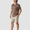 Model in full body wearing a Classic Short-Sleeved Shirt Subtle Flowers