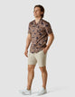 Model in full body wearing a Classic Short-Sleeved Shirt Subtle Flowers