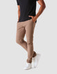 Model from the front wearing a pair of Classic Pants Walnut/Brown with a black t-shirt and white sneakers 