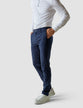Model from the front wearing a pair of Classic Pants marine blue