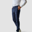 Model from the front wearing a pair of Classic Pants marine blue