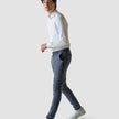 Model in full body wearing a pair of Classic Pants ocean/blue with a white t-shirt and white sneakers 