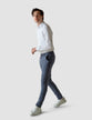 Model in full body wearing a pair of Classic Pants ocean/blue with a white t-shirt and white sneakers 