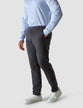 Model from the front wearing a pair of Classic Pants shadow grey