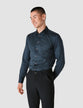 Model from the front wearing a Classic Shirt Metro a shirt innavy with a compact checked pattern in other shades of blue