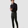 Model in full body wearing a Classic Black Navy Stripes with black classic pants and white sneakers