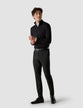 Model in full body wearing a Classic Black Navy Stripes with black classic pants and white sneakers