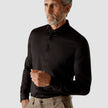 Model from the front wearing a Classic Shirt Black with brown pants 