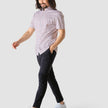 Model in full body wearing a Classic Short-Sleeved Twill Shirt Mahogany Stripes the shirt is White a subtle twill pattern and light bordeaux stripes 