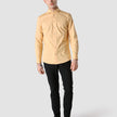 Model in full body wearing a Classic Shirt brick yellow