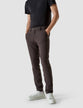 Model from the front wearing a pair of Essential Suit Pants in Dark Shadow/Dark Grey