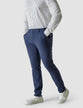 Model from the front wearing a pair of Essential Pants Marine Blue