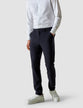 Model from the front wearing a pair of Essential Pants Midnight Blue