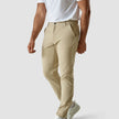 Male model seen from the front in a pair af Essential pants sand/Beige