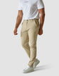 Male model seen from the front in a pair af Essential pants sand/Beige