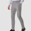 Model from the front wearing a pair of Essential Suit Pants Sterling Grey in a checked pattern