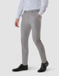 Model from the front wearing a pair of Essential Suit Pants Sterling Grey in a checked pattern
