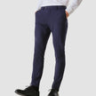 Model from the front wearing a pair of Essential Suit Pants in Bristol Blue with a compact checked pattern