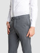 Model in full body wearing a pair of Essential Suit Pants Dark Grey