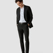 Model in full body wearing a pair of Essential Suit Pants Black