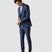 Model in full body wearing a pair of Essential Suit Pants Marine Blue 