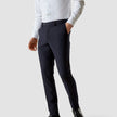 Model from the front wearing a pair of Essential Suit Pants Midnight Blue