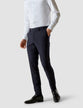 Model from the front wearing a pair of Essential Suit Pants Midnight Blue