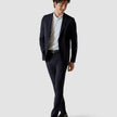 Model in full body wearing a pair of Essential Suit Pants Midnight Blue