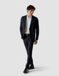 Model in full body wearing a pair of Essential Suit Pants Midnight Blue